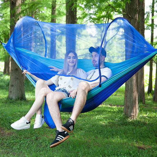 Camping hammock with integrated mosquito net